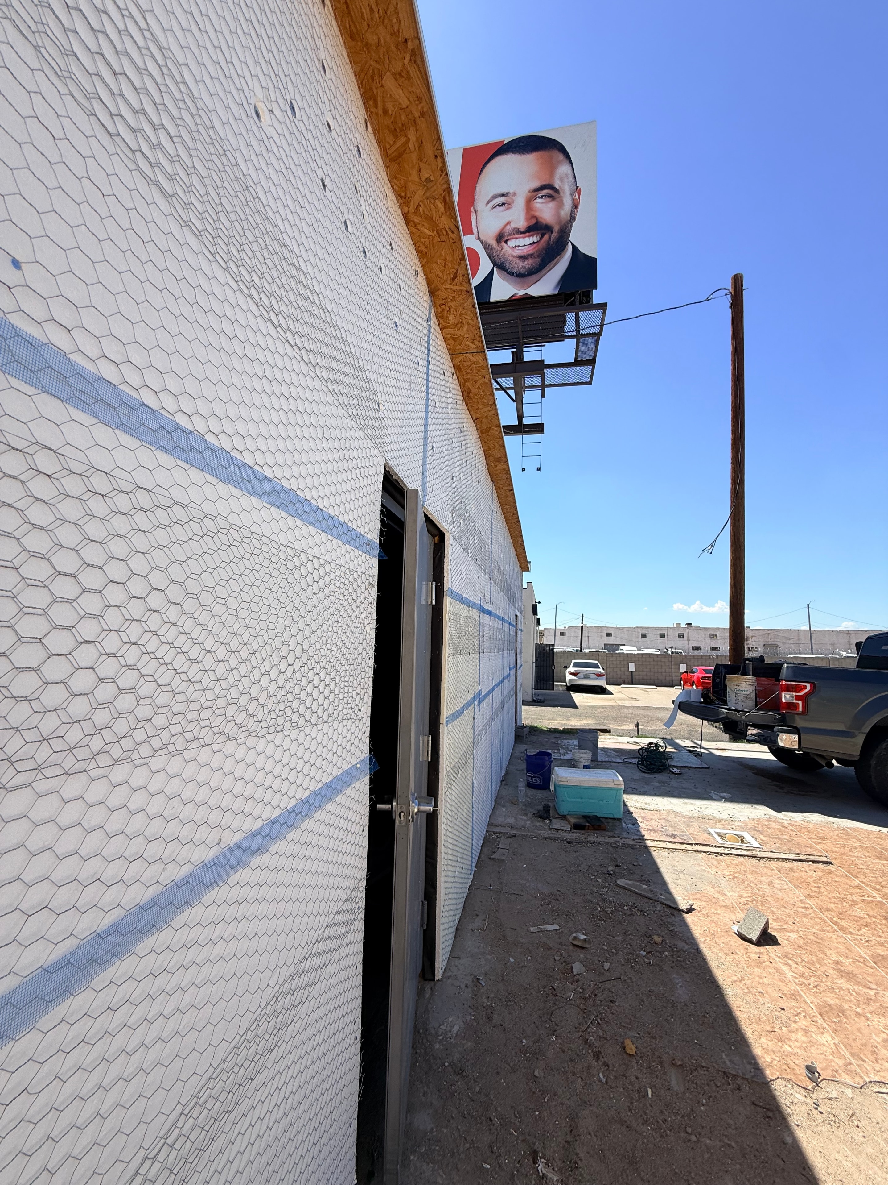 Roof underlayment installation with wire mesh on commercial building
