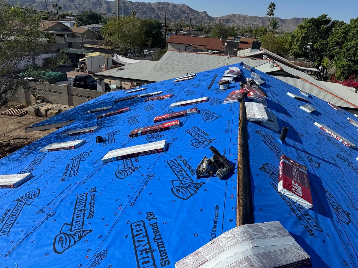 Roof installation with blue underlayment — RMSERVCORP roofing project