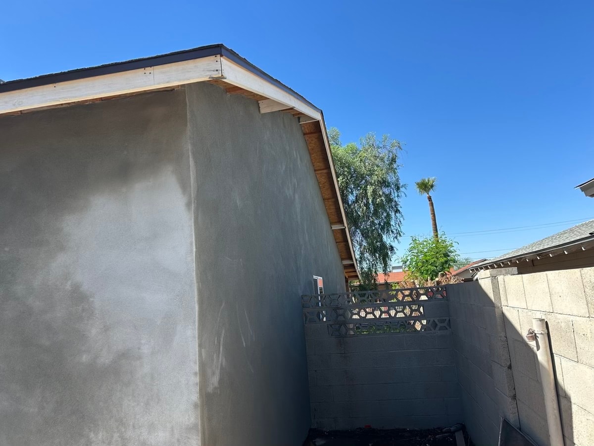 Modern concrete house exterior — completed RMSERVCORP renovation